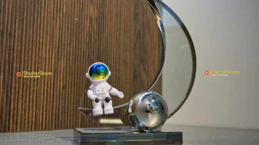 Decorative Astronaut Figurine with Metallic Sphere