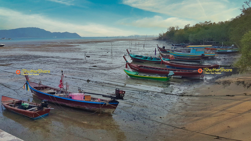 Traditional Thai Fishing Boats at Low Tide