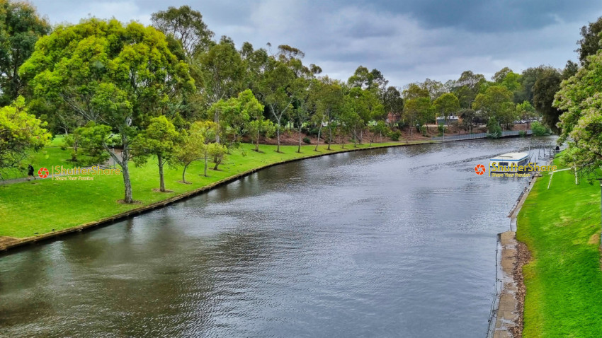 Scenic River View with Houseboat