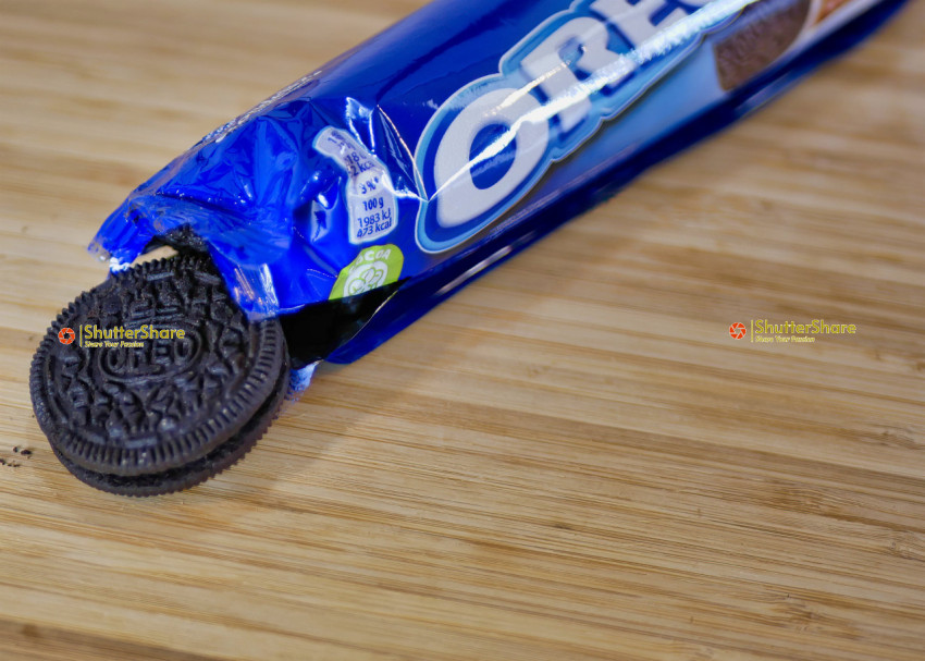 Open Package of Oreo Cookies on Wooden Surface