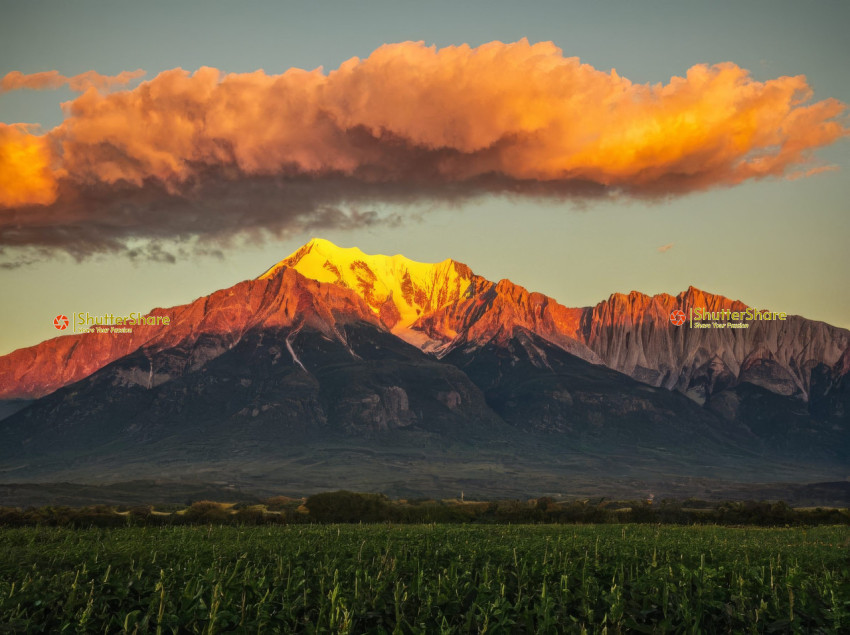 Fiery Sunset Over Snow-Capped Peak