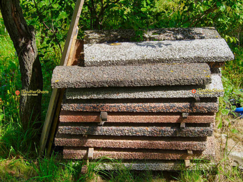 Stacked Concrete Slabs in a Backyard