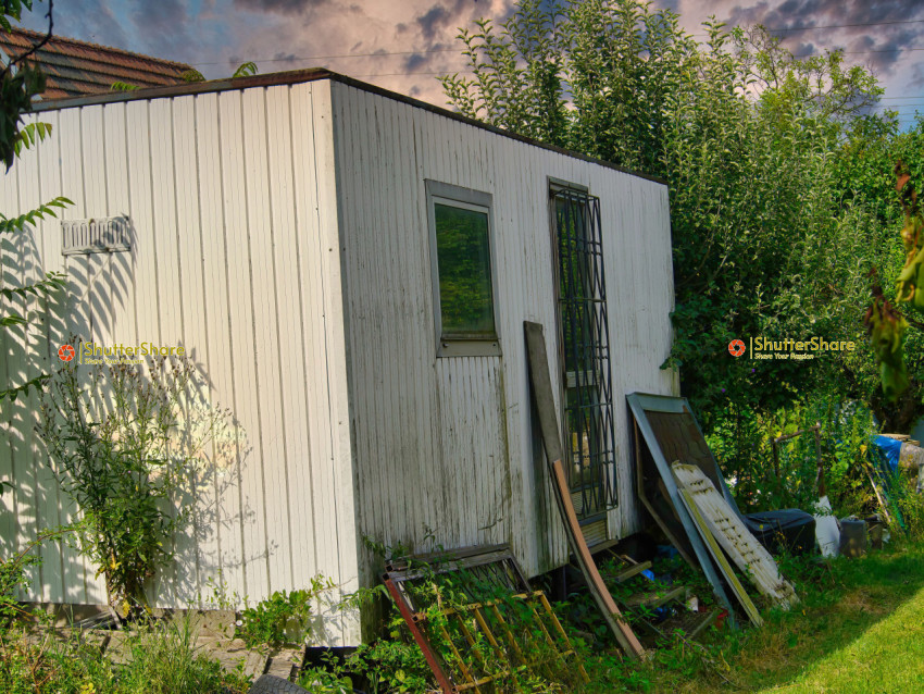 White Trailer with Cluttered Surroundings