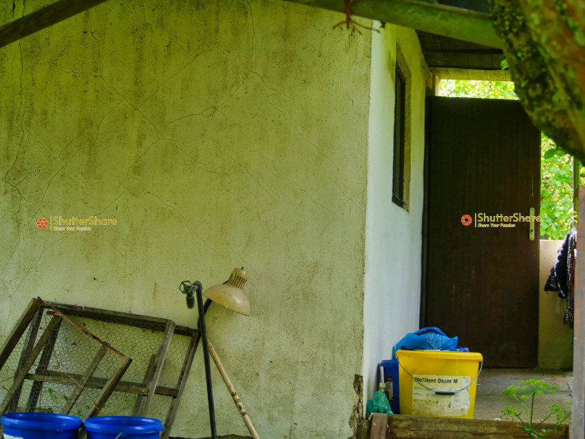 Abandoned Outbuilding with Rusted Tools