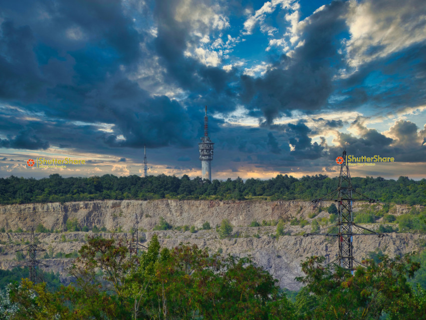 Dramatic Quarry Sunset with Communication Towers